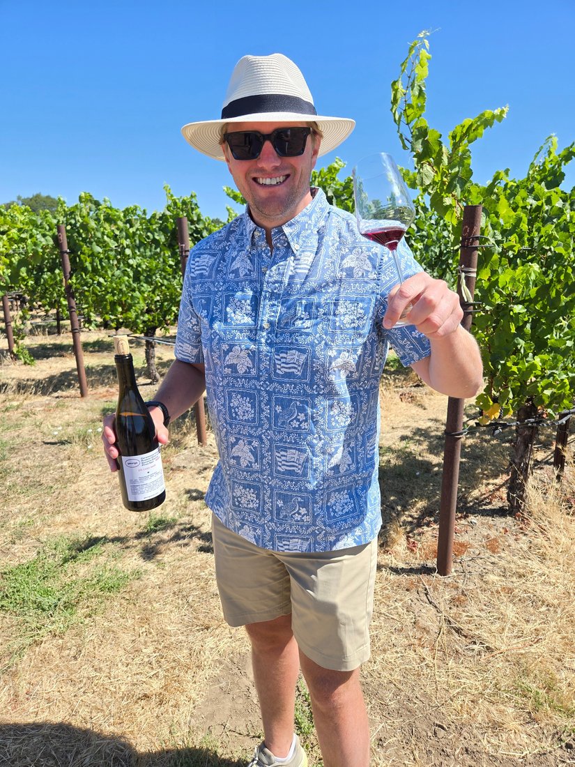 Raising a glass of Pinot Noir in the Russian River Valley vineyard